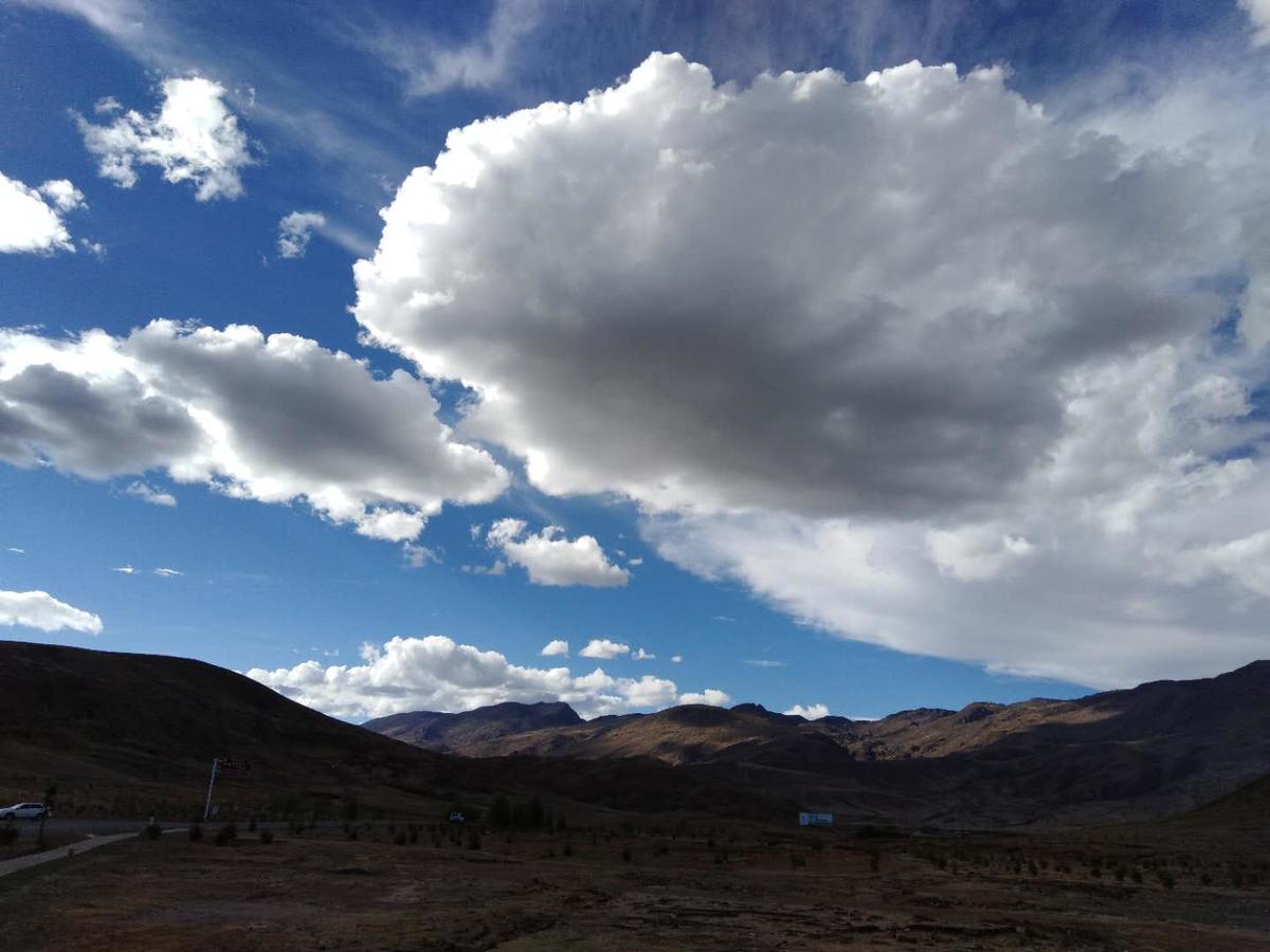 Zishuo Zihua Guest House Daocheng Bagian luar foto