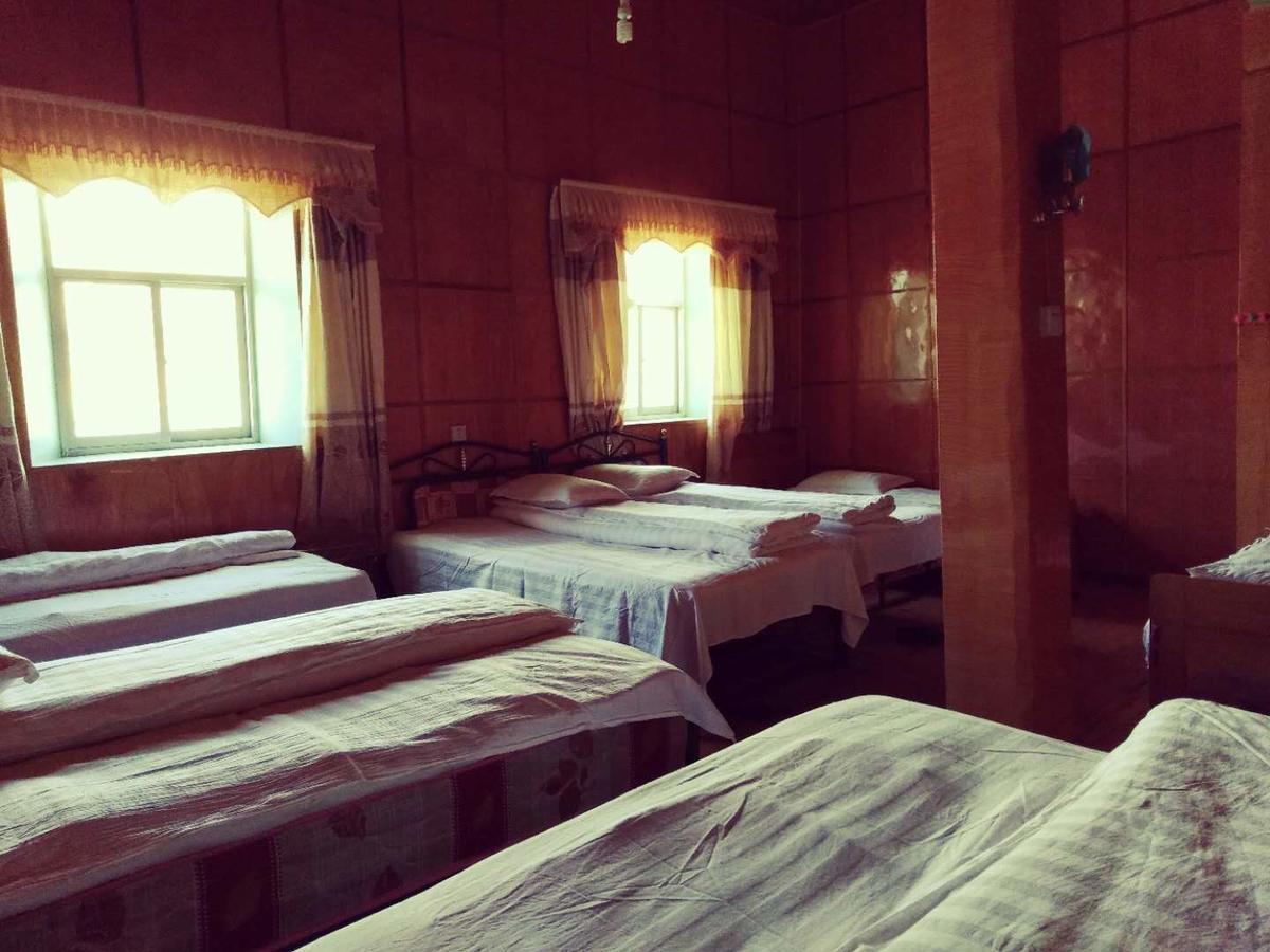 Zishuo Zihua Guest House Daocheng Bagian luar foto