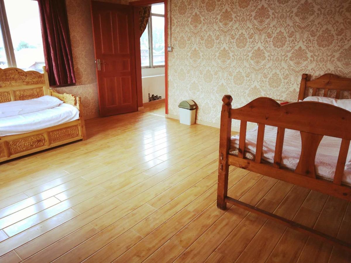 Zishuo Zihua Guest House Daocheng Bagian luar foto