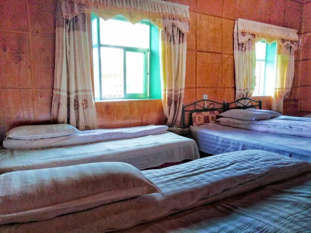 Zishuo Zihua Guest House Daocheng Bagian luar foto