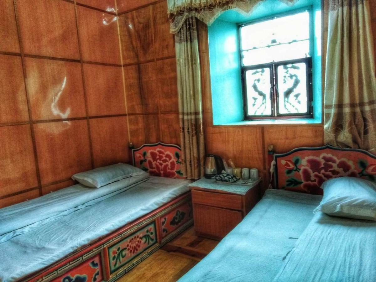 Zishuo Zihua Guest House Daocheng Bagian luar foto